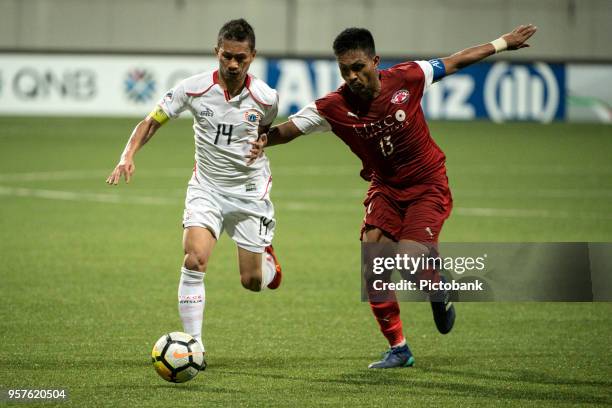 Ismed Sofyan of Persija Jakarta is challenged by Izzdin Shafiq of Home United during the AFC Cup Zonal Semi final between Home United and Persija...