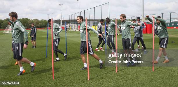 Michael Carrick and Matteo Darmian and Daley Blind of Manchester United in action during a first team training session at Aon Training Complex on May...