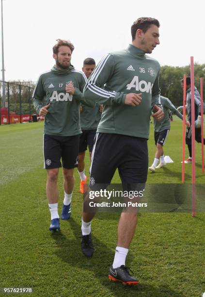 Daley Blind and Matteo Darmian of Manchester United in action during a first team training session at Aon Training Complex on May 12, 2018 in...