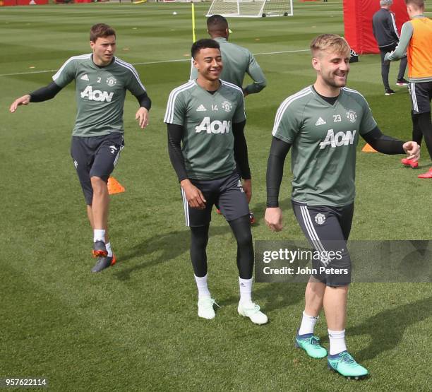 Victor Lindelof, Jesse Lingard and Luke Shaw of Manchester United in action during a first team training session at Aon Training Complex on May 12,...