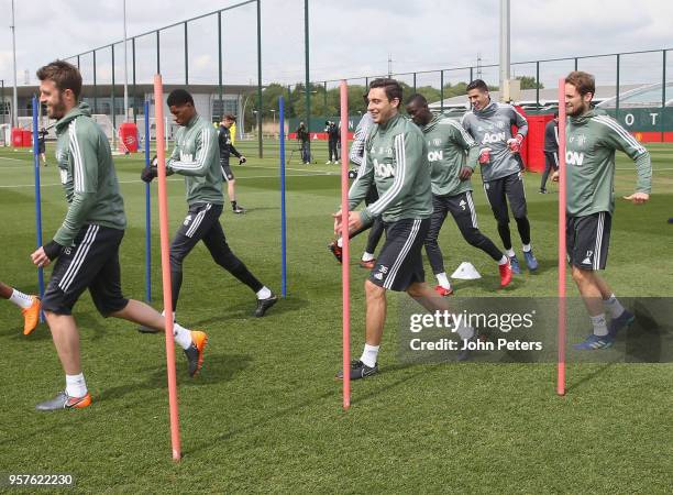 Michael Carrick and Matteo Darmian and Daley Blind of Manchester United in action during a first team training session at Aon Training Complex on May...