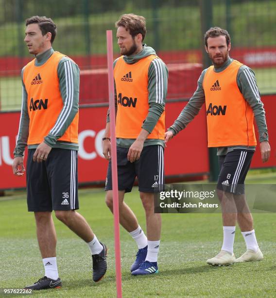 Matteo Darmian, Daley Blind and Juan Mata of Manchester United in action during a first team training session at Aon Training Complex on May 12, 2018...