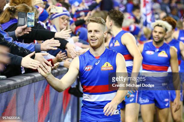 Lachie Hunter of the Bulldogs and teammates celebrates the win with fans during the round eight AFL match between the Western Bulldogs and the...