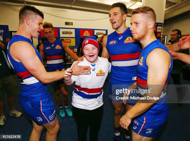 Bulldogs fan sing the club song after winning with Billy Gowers Marcus Bontempelli and Lachie Hunter of the Bulldogs during the round eight AFL match...