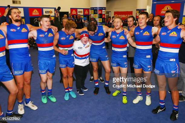 Bulldogs fan sing the club song after winning with Billy Gowers Marcus Bontempelli and Lachie Hunter of the Bulldogs during the round eight AFL match...