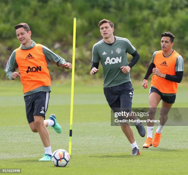 Ander Herrera, Victor Lindelof and Alexis Sanchez of Manchester United in action during a first team training session at Aon Training Complex on May...