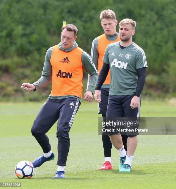 Phil Jones, Luke Shaw and Scott McTominay of Manchester United in action during a first team training session at Aon Training Complex on May 12, 2018...