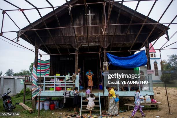 Internally displaced people, fleeing renewed fighting between Myanmar's army and ethnic insurgents in the country's remote north, take shelter at a...