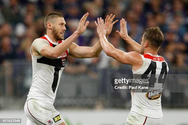 Tom Hickey and Maverick Weller of the Saints celebrate a goal during the round eight AFL match between the Fremantle Dockers and the St Kilda Saints...