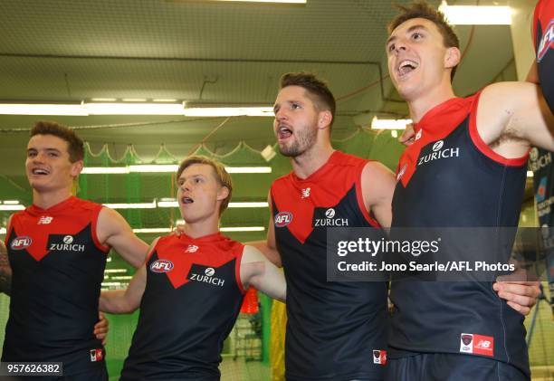 Jesse Hogan of the Demons celebrates the win with team mates after the round eight AFL match between the Gold Coast Suns and the Melbourne Demons at...