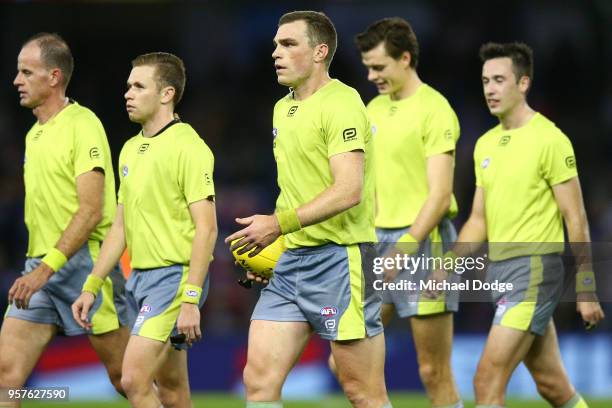 Umpire Leigh Fisher leads fellow umpires off during the round eight AFL match between the Western Bulldogs and the Brisbane Lions at Etihad Stadium...