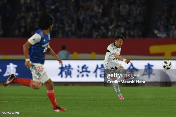 Jungo Fujimoto of Gamba Osaka scores the first goal during the J.League J1 match between Yokohama F.Marinos and Gamba Osaka at Nissan Stadium on May...