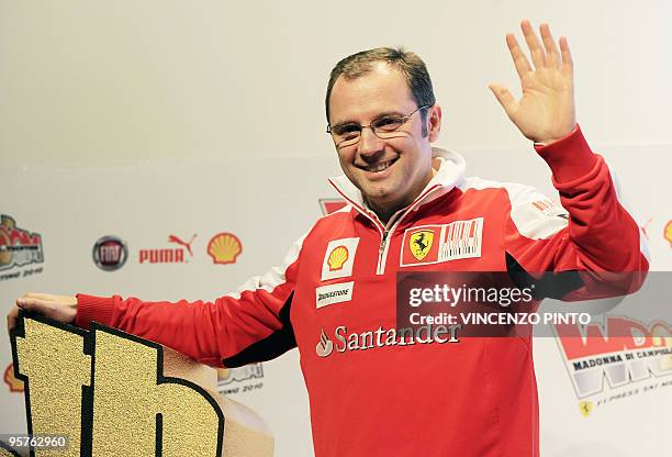 Ferrari F1 Team manager Stafano Domenicali waves at the end of a news conference on January 13, 2010 during the "Wrooom 2010, F1 and MotoGP Press Ski...