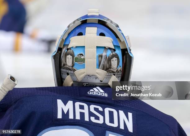 Goaltender Steve Mason of the Winnipeg Jets takes part in the pre-game warm up prior to NHL action against the Nashville Predators in Game Six of the...