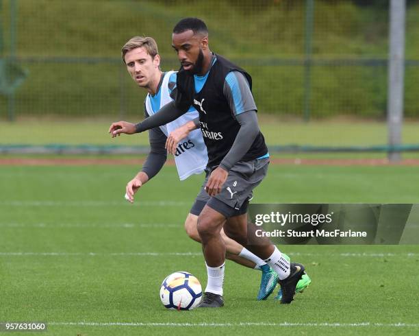 Nacho Monreal and Alex Lacazette of Arsenal during a training session at London Colney on May 12, 2018 in St Albans, England.