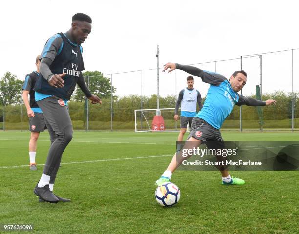 Danny Welbeck and Santi Cazorla of Arsenal during a training session at London Colney on May 12, 2018 in St Albans, England.