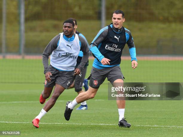 Ainsley Maitland-Niles and Granit Xhaka of Arsenal during a training session at London Colney on May 12, 2018 in St Albans, England.