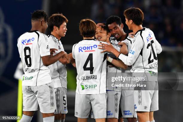 Jungo Fujimoto of Gamba Osaka celebrates scoring his side's first goal during the J.League J1 match between Yokohama F.Marinos and Gamba Osaka at...