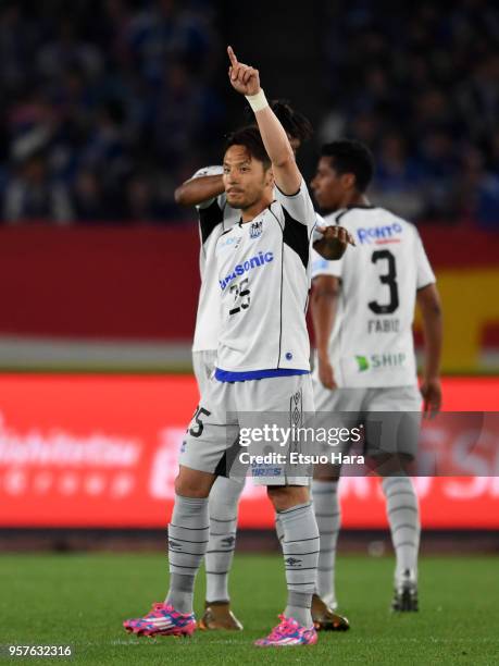 Jungo Fujimoto of Gamba Osaka celebrates scoring his side's first goal during the J.League J1 match between Yokohama F.Marinos and Gamba Osaka at...