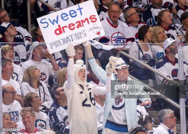 Winnipeg Jets fans hold up a sign prior to puck drop between the Jets and the Nashville Predators in Game Six of the Western Conference Second Round...