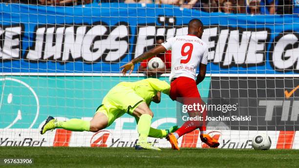 Daniel Keita-Ruel of Koeln challenges Michael Ratajczak of Paderborn and shoot the Goal 1:1 for Koeln during the 3. Liga match between SC Fortuna...