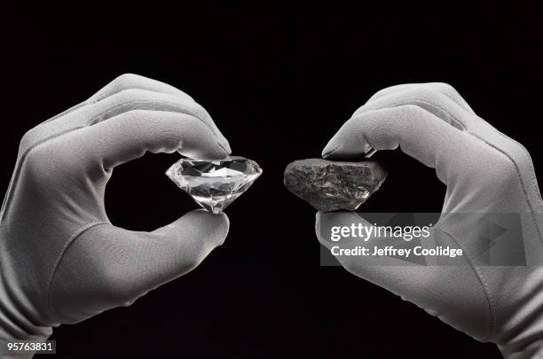 diamond and coal in gloved hands - carbon cycle stock pictures, royalty-free photos & images