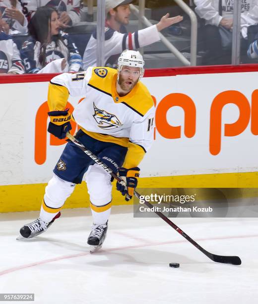 Mattias Ekholm of the Nashville Predators plays the puck down the ice during second period action against the Winnipeg Jets in Game Six of the...