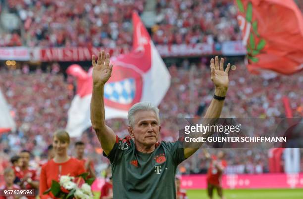 Bayern Munich's German head coach Jupp Heynckes waves good bye to the fans as he arrives for his last match as Munich's coach prior to the German...