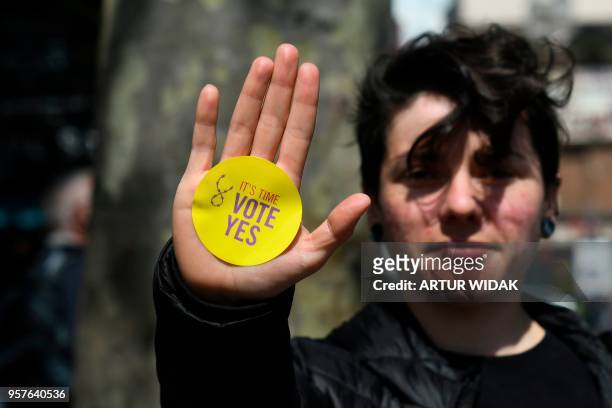 Woman canvassing for the 'Yes' campaign, urging a yes vote in the referendum to repeal the eighth amendment of the Irish constitution, a subsection...