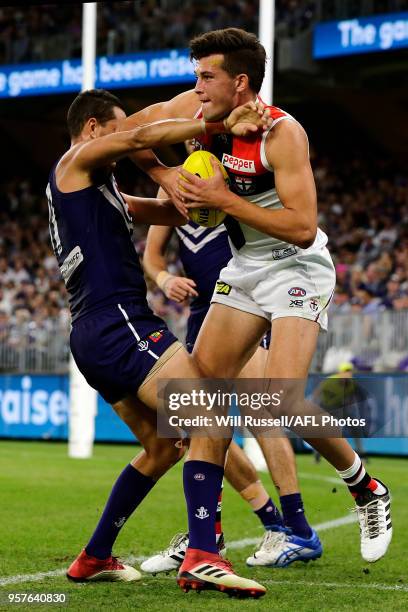 Rowan Marshall of the Saints is shepherded over the line by Michael Johnson of the Dockers during the round eight AFL match between the Fremantle...