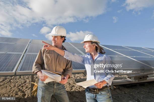 engineers in solar plant - chris sattlberger stock pictures, royalty-free photos & images