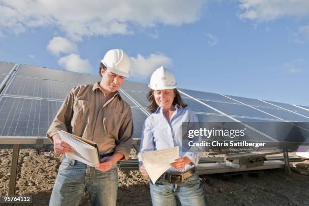 engineers in solar plant - chris sattlberger stock pictures, royalty-free photos & images