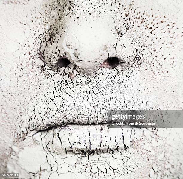 close up of mouth and nose covered in dry mud - people covered in mud stock pictures, royalty-free photos & images
