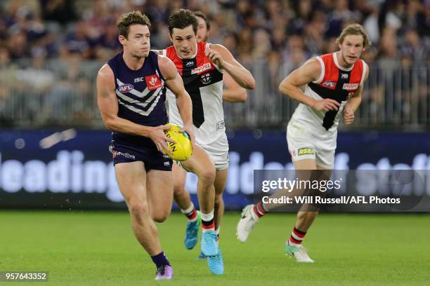 Lachie Neale of the Dockers looks to pass the ball during the round eight AFL match between the Fremantle Dockers and the St Kilda Saints at Optus...