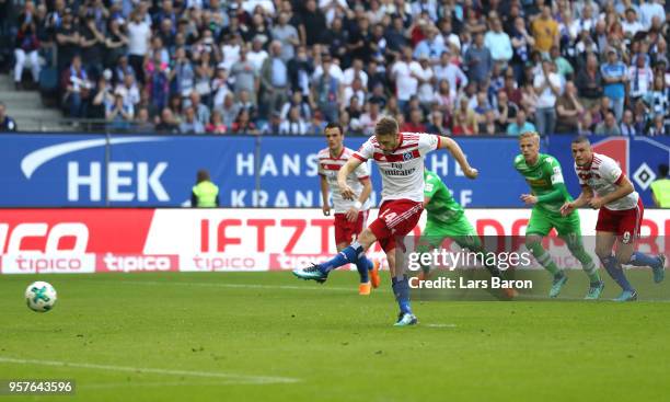 Aaron Hunt of Hamburger SV scores his sides first goal from the penalty spot during the Bundesliga match between Hamburger SV and Borussia...