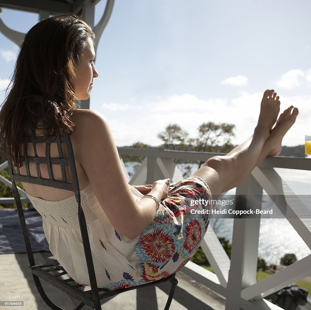 Woman relaxing on balcony