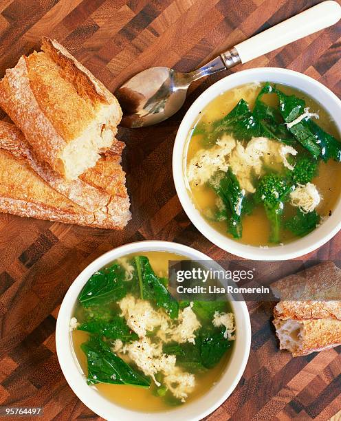bowls of stracciatella with broccoli rabe - broccoli rabe fotografías e imágenes de stock