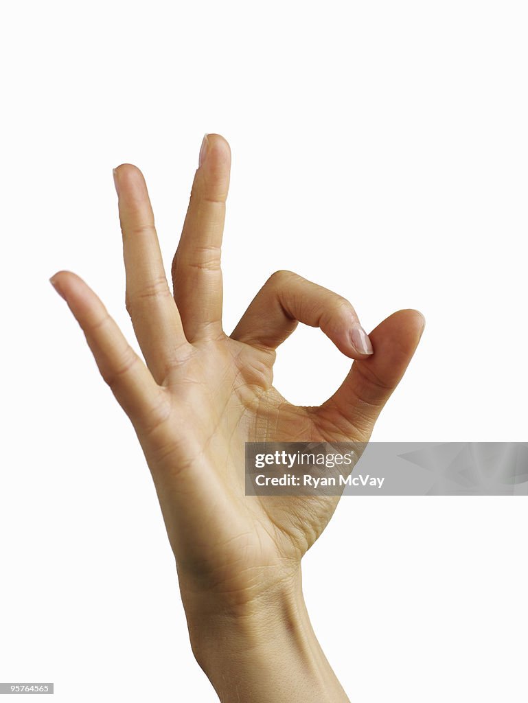 Hand giving "OK" symbol