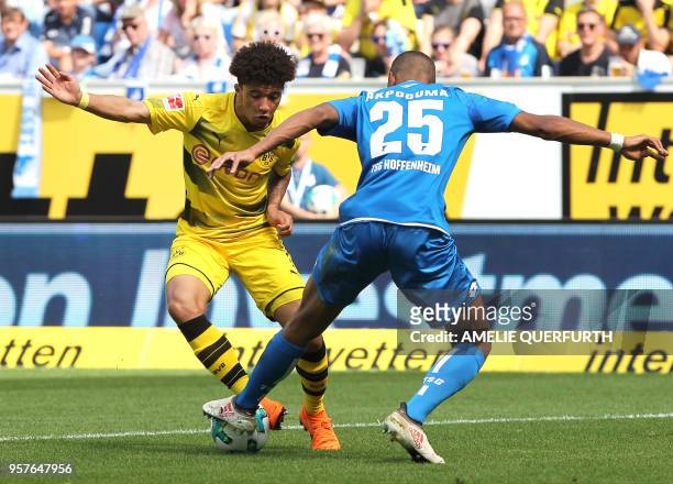 Hoffenheim's German defender Kevin Akpoguma and Dortmund's English midfielder Jadon Sancho vie for the ball during the German first division...