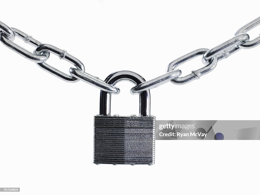 Padlock and chain on white