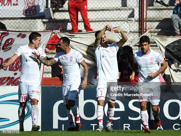 Ignacio Pussetto of Huracan celebrates with teammates after scoring the first goal of his team during a match between Huracan and Boca Juniors as...
