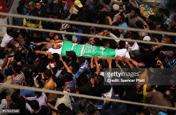 The body of Jabir Abu Mustafa is brought through the streets of Khan Yunis during his funeral on May 12, 2018 in Khan Yunis, Gaza. Mustafa , who had...