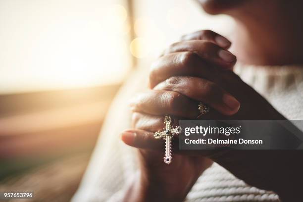 prayer is the pillar of strength - praying hands with rosary beads stock pictures, royalty-free photos & images
