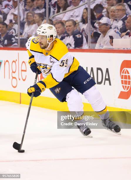 Roman Josi of the Nashville Predators plays the puck around the boards during first period action against the Winnipeg Jets in Game Six of the...