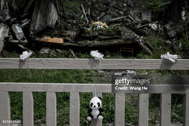 Toy panda seen at the ruins of earthquake-hit Beichuan county during the ten year anniversary on May 12, 2018 in Beichuan Qiang Autonomous County,...
