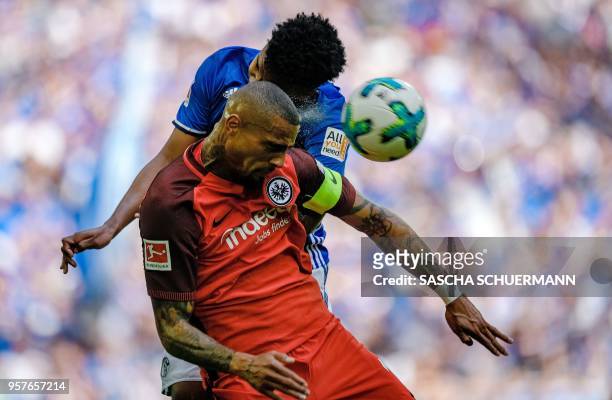 Schalke's US midfielder Weston McKennie and Frankfurt's Ghanaian midfielder Kevin-Prince Boateng vie for the ball during the German first division...
