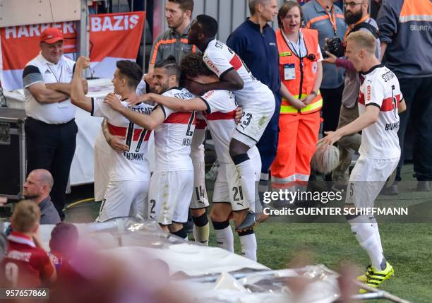 Stuttgart's German forward Daniel Ginczek celebrates the forth goal with teammates during the German first division Bundesliga football match FC...