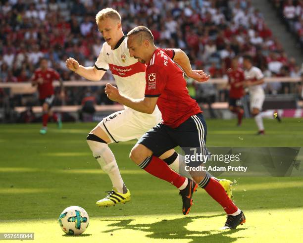 Franck Ribery of Bayern Muenchen runs for the ball with Timo Baumgartl of Stuttgart during the Bundesliga match between FC Bayern Muenchen and VfB...