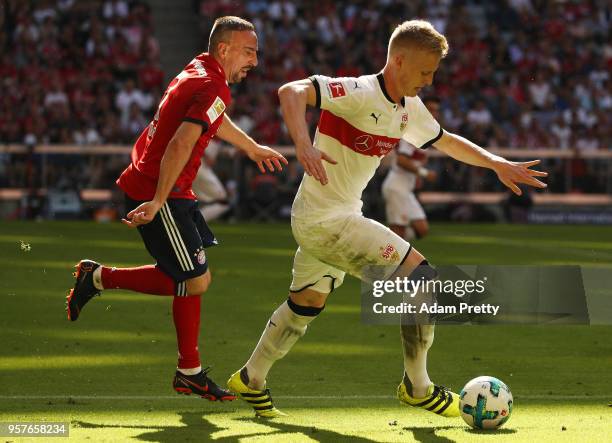 Timo Baumgartl of Stuttgart is chased by Franck Ribery of Bayern Muenchen during the Bundesliga match between FC Bayern Muenchen and VfB Stuttgart at...