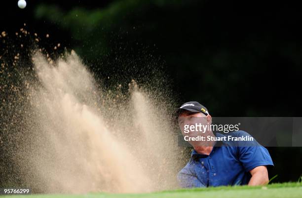 Deane Pappas of Soth Africa plays his bunker shot during the first round of the Joburg Open at Royal Johannesburg and Kensington Golf Club on January...